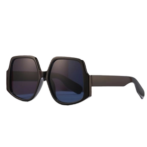 Fashionable oversized irregular sunglasses with thick black frame and dark blue lenses