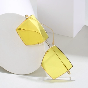 Fashionable square metal sunglasses with yellow gradient lenses on geometric display stands