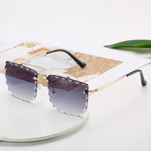Frameless oversized sunglasses with purple gradient scalloped lenses and gold metal temples