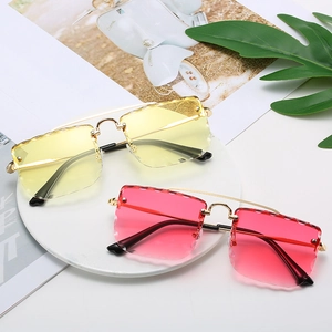 Frameless oversized square sunglasses with gold metal frame and tinted wavy edge lenses