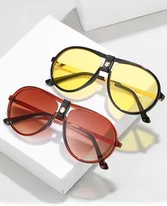 Detail of aviator computer glasses featuring leather bridge and gold rivet accents