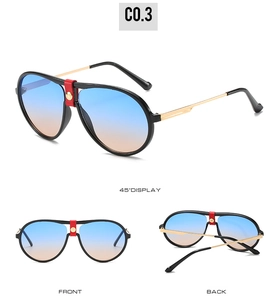 Detail of aviator sunglasses with gradient lenses and red leather rivet bridge detail