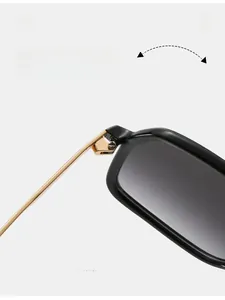 Macro shot of durable golden metal hinge and sleek black frame on oversized sunglasses