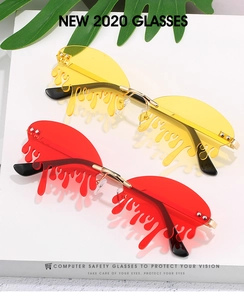 Detailed view of frameless teardrop sunglasses with red and yellow tinted lenses