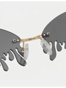 Detailed macro view of comfortable silicone nose pads and golden bridge on teardrop sunglasses