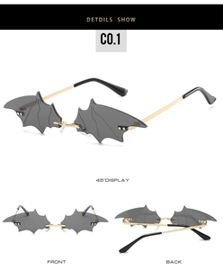 Detailed views of creative bat-shaped rimless sunglasses with gold metal temples