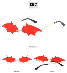 Three-view display of red bat-wing sunglasses with gold metal temples for parties