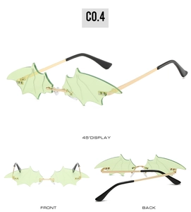 Detail view of light green bat-wing sunglasses with gold metal temples and C0.4 mark