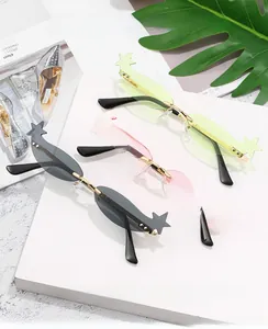 Three pairs of stylish star-shaped rimless sunglasses in grey pink and green colors