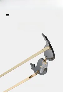 Close-up of golden metal temples and silicone nose pads on star-shaped sunglasses
