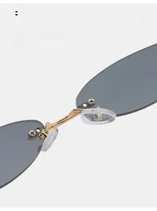 Detail of comfortable silicone nose pads on rimless star sunglasses with gold metal bridge