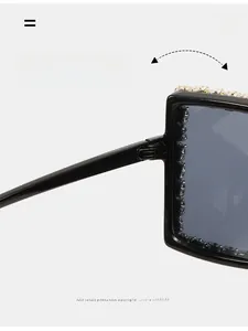 Detail of durable texture hinge and rhinestone embellishment on black oversized sunglasses