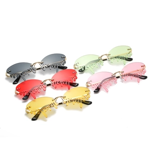 Fashionable rimless teardrop sunglasses set in five colors with gold metal accents