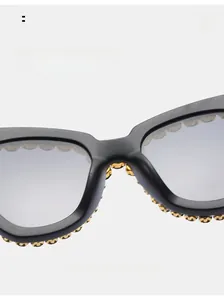 Detail of ergonomic nose pads and crystal-studded black punk sunglasses frames