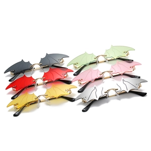 Fashionable bat-shaped rimless sunglasses in multiple colors for Halloween and party wear