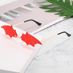 Fashionable red bat shaped rimless sunglasses with gold metal temples for parties
