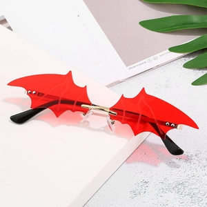 Fashionable bat wing shaped sunglasses with red lenses and gold metal frame for Halloween
