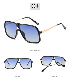 Detail view of aviator sunglasses with black frame and blue gradient lenses