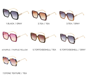 Detail of square oversized sunglasses collection with pearl accents on temples in seven colors
