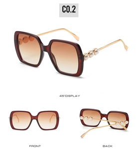 Detailed views of wine red sunglasses featuring gold metal temples with pearl accents