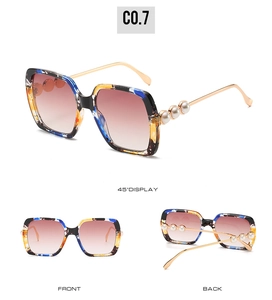 Detailed views of square tortoiseshell sunglasses with gold temples and pearl accents