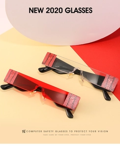 Detail of frameless rectangular glasses with snakeskin texture accents and clear red lenses