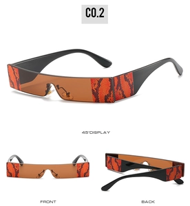 Macro detail of rectangular sunglasses with brown lenses and red snakeskin pattern arms