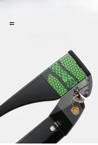 Detail of glossy black temples with green pattern and flexible hinges for sunglasses