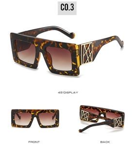Detailed views of oversized tortoise shell sunglasses with golden geometric temple accents
