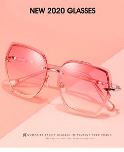 Close-up of rimless geometric sunglasses with pink gradient lenses and metal bridge