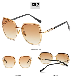 Detail view of rimless gradient brown sunglasses with gold metal diamond-set temples