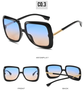 Black square sunglasses with gradient blue-orange lenses and gold metal accents