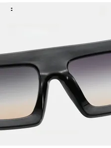 Macro shot of comfortable nose pads on oversized black sunglasses with gradient lenses