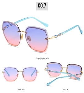 Three-way view of rimless oversized sunglasses with gradient blue-purple lenses and gold accents