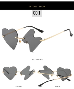 Detail view of gold frame heart and lightning bolt asymmetric rimless sunglasses