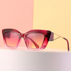 Chic cat-eye sunglasses with gradient red lenses and gold hollow metal temples for women