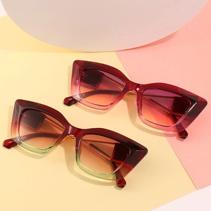 Cat-eye sunglasses in trendy gradient frames featuring red and orange fashion lenses