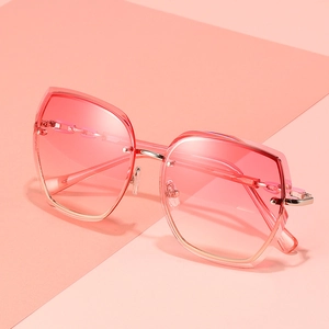 Fashionable rimless oversized geometric sunglasses with pink gradient lenses and chain temple