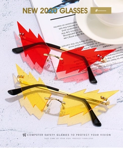 Detail of lightning-shaped rimless sunglasses in red and orange with gold metal arms
