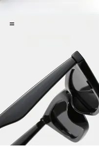 Detail of glossy black cat eye sunglasses showing light and super elastic texture material