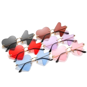 Funny heart-shaped rimless sunglasses in multiple colors for parties and fashion styling