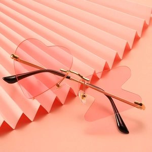 Pink heart and flame shaped rimless sunglasses with gold metal temples for women