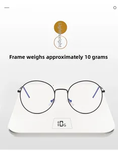 Detail shot showing a lightweight 10g round black metal eyeglass frame on a digital scale