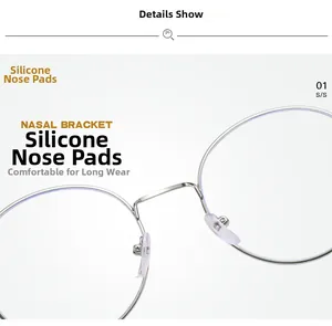 Close-up of soft silicone nose pads on a silver round metal eyeglass frame