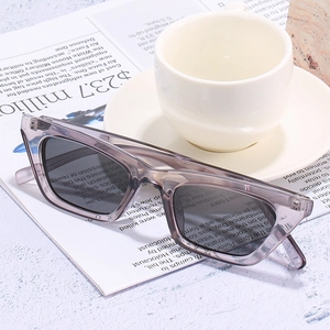 Retro small cat-eye sunglasses with translucent jelly frame and dark square lenses