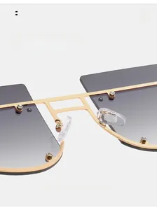 Detail of comfortable silicone nose pads on oversized square metal rivet sunglasses
