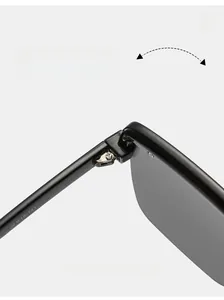 Detailed macro view of the high-quality metal hinge and frame specs of oversized sunglasses