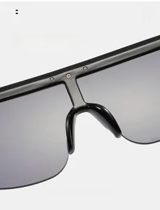 Macro shot of comfortable wide integrated nose pads on black shield sunglasses