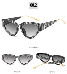 Three-view layout of black cat eye sunglasses with rhinestone trim and gold metal temples