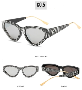 Cat eye sunglasses with black frames, rhinestones and slim gold metal temples